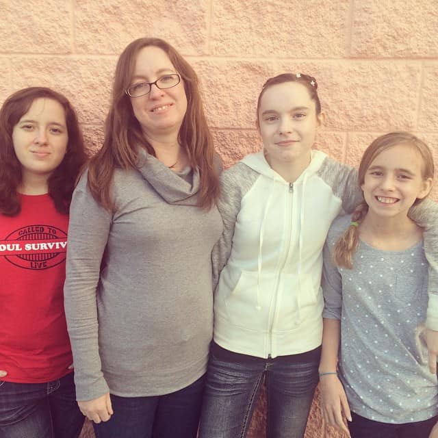 Me, along with my three youngest girls. This picture was taken yesterday after Hannah's {wearing the white sweater} ice skating performance.
